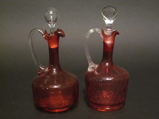 2 Victorian cranberry glass ewer and stoppers with clear glass handles 9"