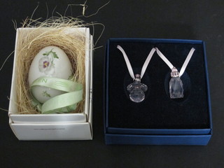 A Royal Copenhagen Christmas tree bauble in the form of a egg  with floral decoration and 2 Swarovski glass pendants in the form  of a bottle and a babies dummy