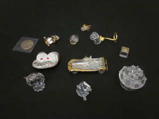 A Swarovski figure of a vintage motor car, a cake, a dummy, balloons, a brooch in the form of a clown, a Pierrot brooch,  figure of an owl - f, a pin and 3 other items