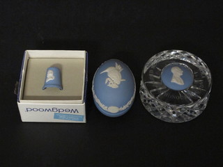 A circular Wedgwood cut glass and blue jasper paperweight  decorated a portrait bust of Earl Mountbatton, an oval egg shaped  trinket box decorated a kingfisher and a thimble decorated Josiah  Wedgwood