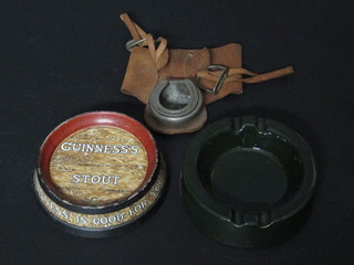 A circular Guinness advertising ashtray in the form of a barrel, base marked A Guinness & Co Dublin AG55, chip to rims, 4  1/2", a Wade green glazed ashtray for Access card and a leather  and chrome ashtray in the form of a saddle