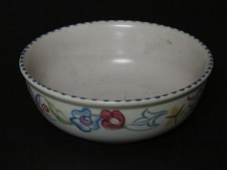 A circular Poole Pottery bowl with floral decoration, the reverse with dolphin mark 5 1/2"