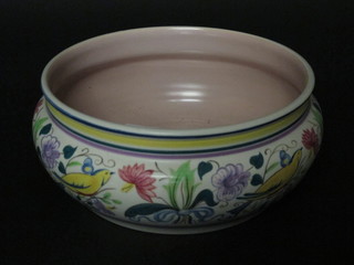 A circular Poole Pottery bowl incised Poole England 564, with floral decoration 9"