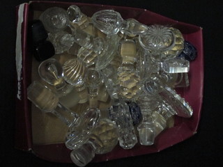 A quantity of various glass stoppers
