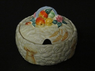 A circular Clarice Cliff Harvest pattern preserve jar and cover,  the base marked 52A, 4"