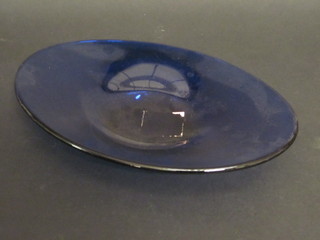 An oval blue glass bowl 14"