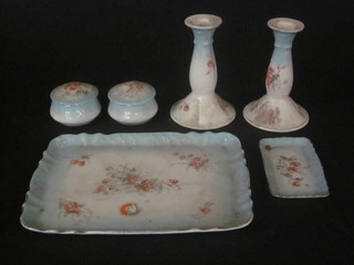 An Edwardian 6 piece dressing table set comprising rectangular turquoise glaze and floral patterned tray, pin tray, pair of  candlesticks and pair of jars and covers