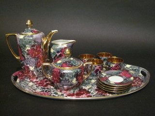 A Czechoslovakian 12 piece cabaret set with lustre decoration comprising twin handled tray, coffee pot, cream jug, sugar bowl,  4 cups and 4 saucers