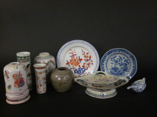 A collection of Oriental ceramics including vases, plates, ginger jars and an invalid feeding cup