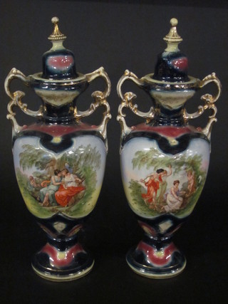 A pair of Edwardian pottery twin handled urns and covers 20", 1 f and r,