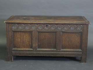 An 18th Century oak coffer of panelled construction with hinged lid, 48"