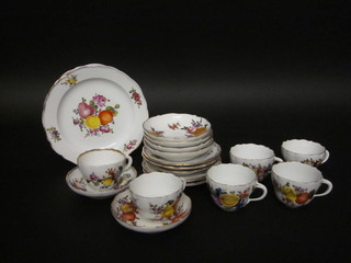 A 20 piece Meissen style tea service comprising 2 8 1/2" plates  with fruit decoration, 6 6" side plates, 6 cups and 6 saucers, the  bases with cross swords mark and incised 13, seconds,