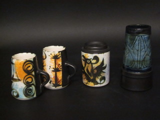 A Celtic cylindrical pottery vase together with a do. jar and cover 5" and 2 mugs