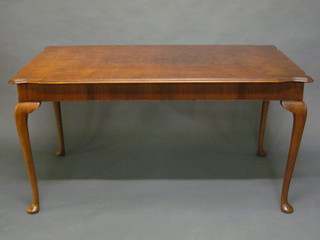 A Queen Anne style rectangular walnut library/dining table, raised on cabriole supports 57"