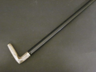 A Victorian ebonised cane with silver handle