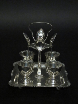 A silver plated 4 piece egg cruet complete with spoons