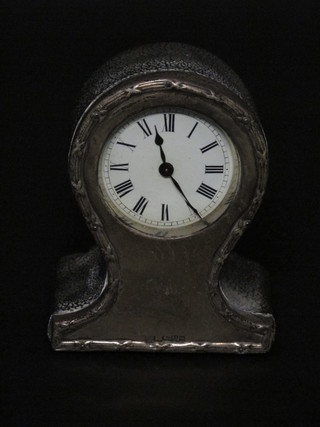 An Edwardian bedroom clock contained in a balloon shaped  silver case with enamelled dial and Roman numerals, Chester  1904 4"
