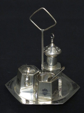 An Eastern white metal 3 piece cruet and stand with salt, mustard  and pepper decoration and niello decoration