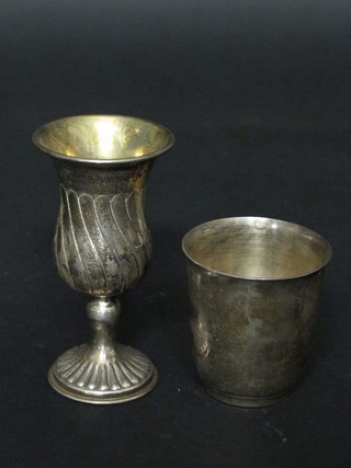 An Eastern white metal embossed goblet 4" and a white metal  beaker