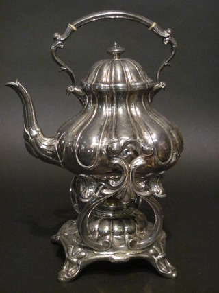 A handsome Britannia metal tea kettle of melon form complete with stand and burner