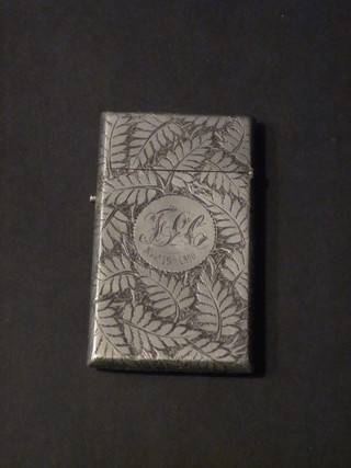 A Victorian engraved white metal card case