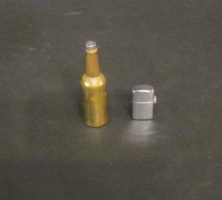 A miniature lighter and a miniature gilt metal bottle