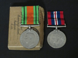 A pair Defence and British War medal with original box