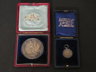 2 silver Bedford Golf Club medallions