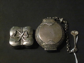 An Eastern white metal trinket box with hinged lid 1 1/2" and an Eastern white metal circular trinket box and cover with hinged lid  hung on a chain