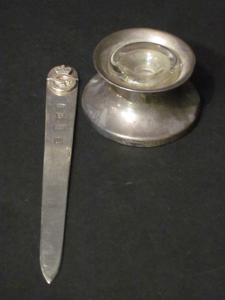 A silver paper knife decorated the crest of the Royal Air Force together with a silver waisted inkwell with glass liner