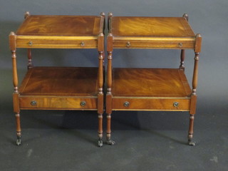 A pair of Georgian style inlaid mahogany lamp tables, fitted  brushing slides, raised on turned and block supports, the base  fitted a drawer 17"
