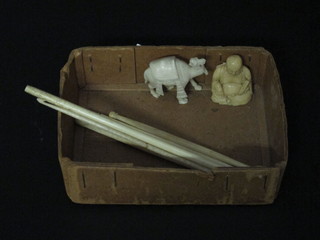 A miniature carved ivory figure of a camel, do. seated Buddha  and 6 ivory crochet hooks