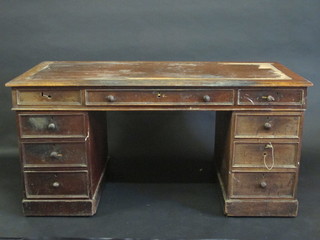 A Victorian mahogany kneehole pedestal desk with inset writing surface above 1 long and 8 short drawers 60"