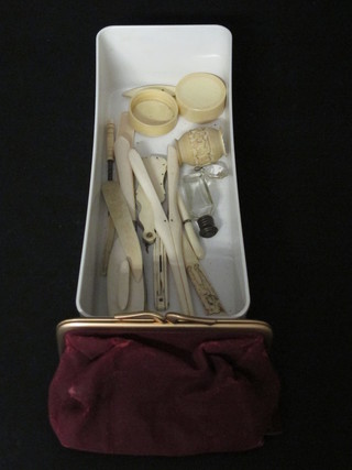 A carved ivory cigarette holder, pair of ivory glove stretchers,  etc