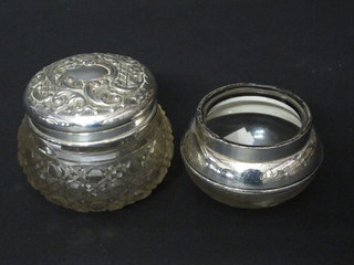 An Edwardian circular cut glass bowl with embossed silver lid, Birmingham 1905 and 1 other dressing table jar with silver rim