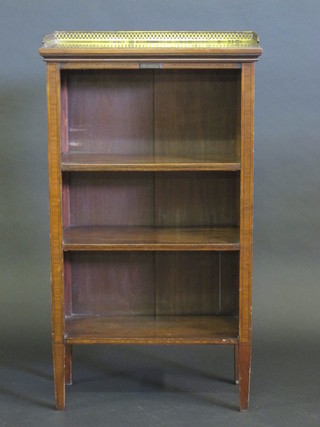An Edwardian inlaid mahogany bookcase with brass three-quarter gallery, fitted adjustable shelves raised on square tapering  supports 21"