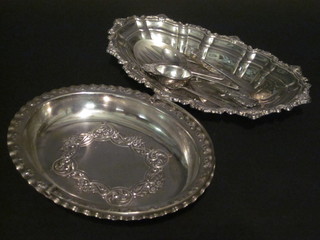 An oval embossed silver plated cake basket with swing handle, an  oval silver dish and a collection of silver plated flatware