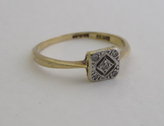 A gold illusion diamond set dress ring