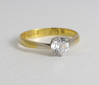 An 18ct gold dress ring set a white stone