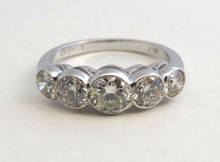 A lady's 18ct white gold engagement/dress ring set 5 round  brilliant cut diamonds, approx 1.40ct