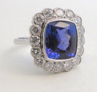 A lady's 18ct white gold dress ring set a square cut tanzanite surrounded by numerous diamonds approx. 1.40/5.20ct