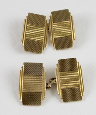 A pair of 9ct gold cufflinks with engine turned decoration