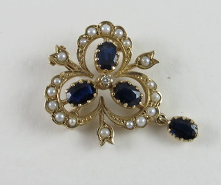 A 9ct gold pendant/brooch set sapphires and pearls