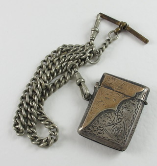 An Edwardian engraved silver and gold vesta case, Birmingham  1902 hung a white metal double Albert