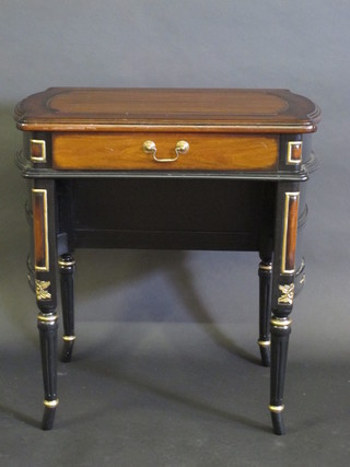 A Continental style shaped mahogany writing table fitted a  drawer, raised on turned and fluted supports 30"