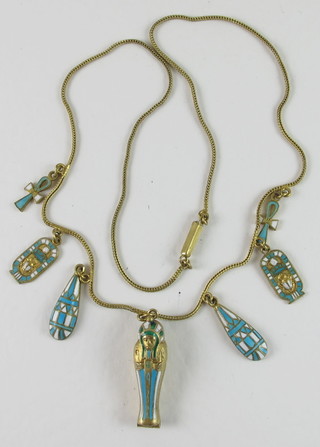 A fine gilt metal chain hung a gilt metal and enamelled pendant containing a Mummy