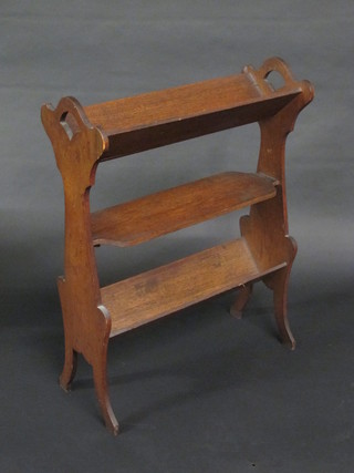 An oak Art Nouveau twin handled 2 tier book trough  incorporating a shelf 22"