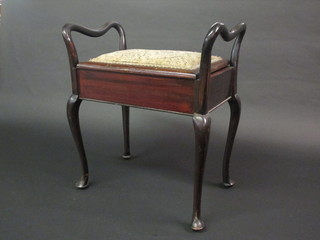 A rectangular mahogany box seat piano stool with hinged lid  raised on cabriole supports