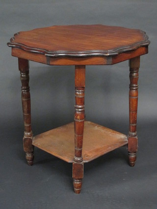 A circular Edwardian mahogany 2 tier occasional table raised on  turned supports 26"