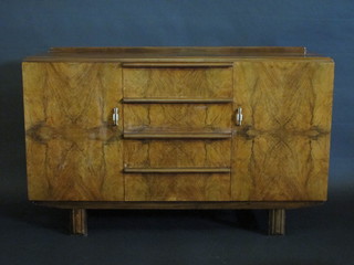 An Art Deco 1930's walnut sideboard fitted 4 long drawers  flanked by a pair of cupboards 53"